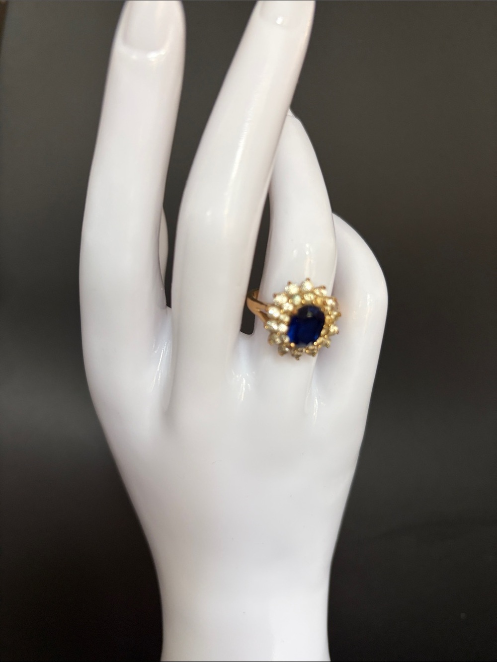Vintage gold tone ring with Sapphire-Blue Center and rhinestone Halo